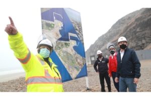 Berg 01 worker stands in front of a map depicting the massive Port of Chancay in Peru